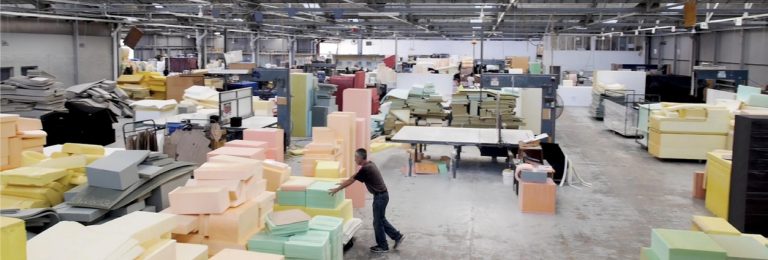 Foam blocks on a factory floor ready for cutting to size