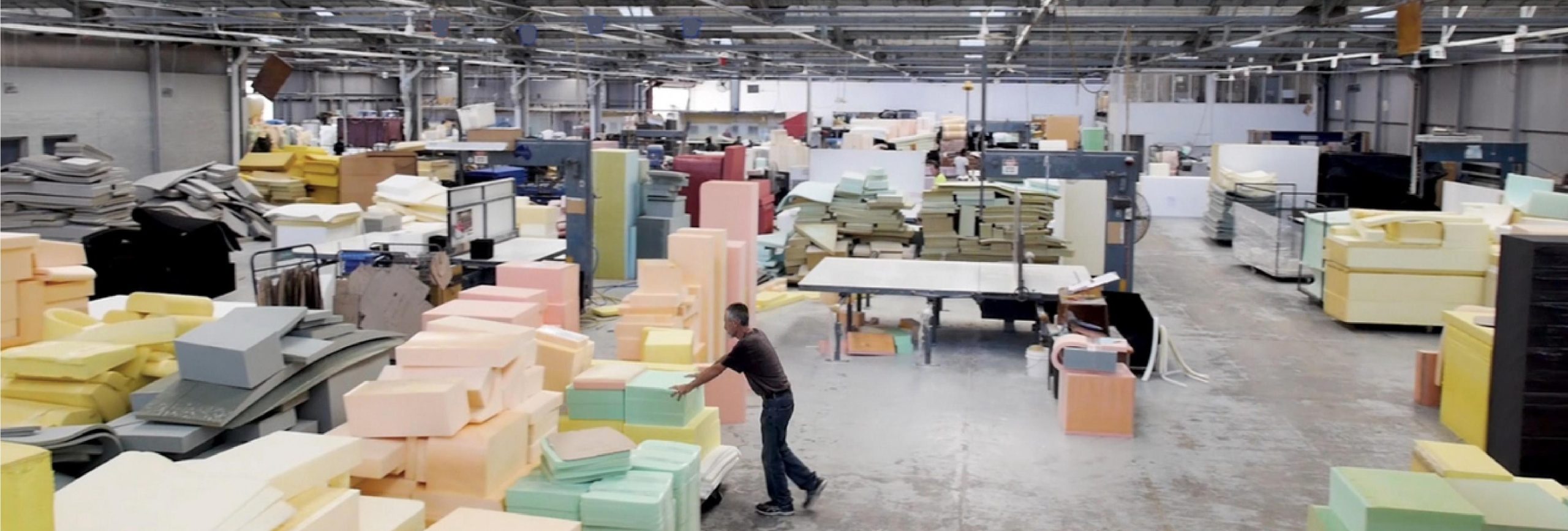 Foam blocks on a factory floor ready for cutting to size