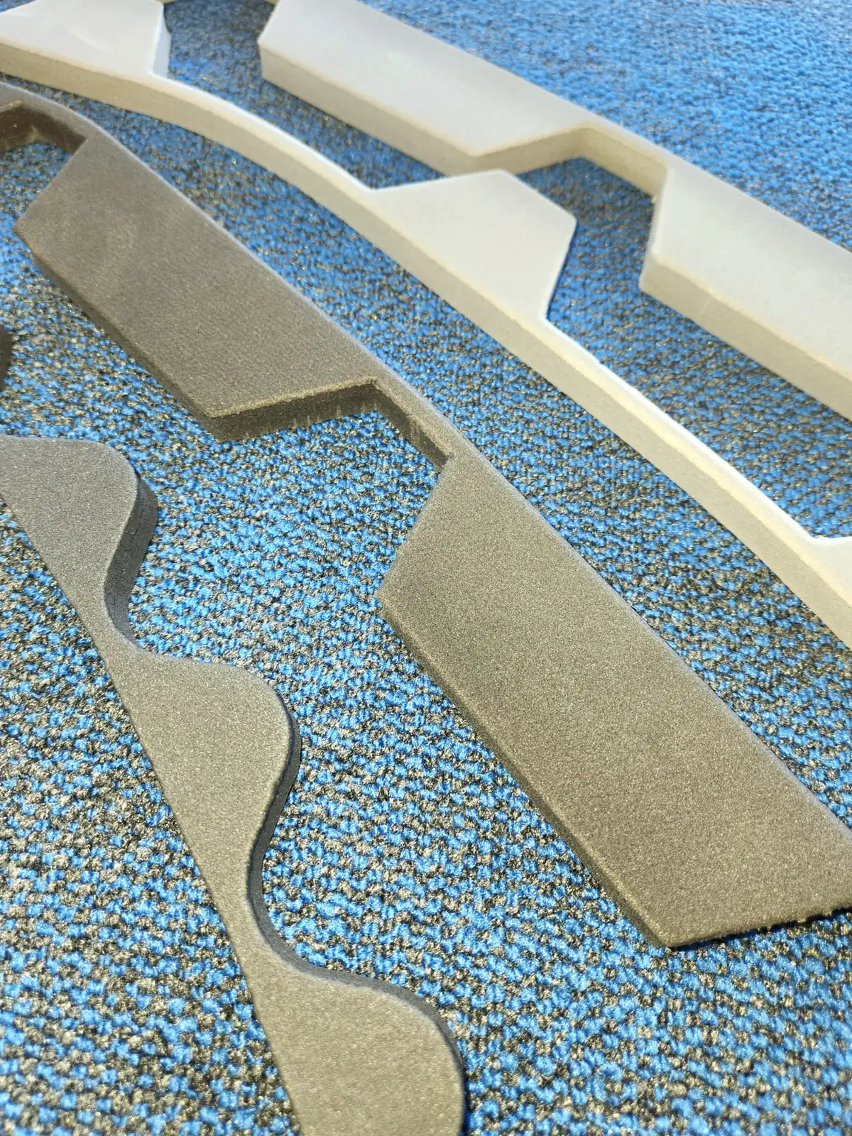Foam roof closure strips for building and construction